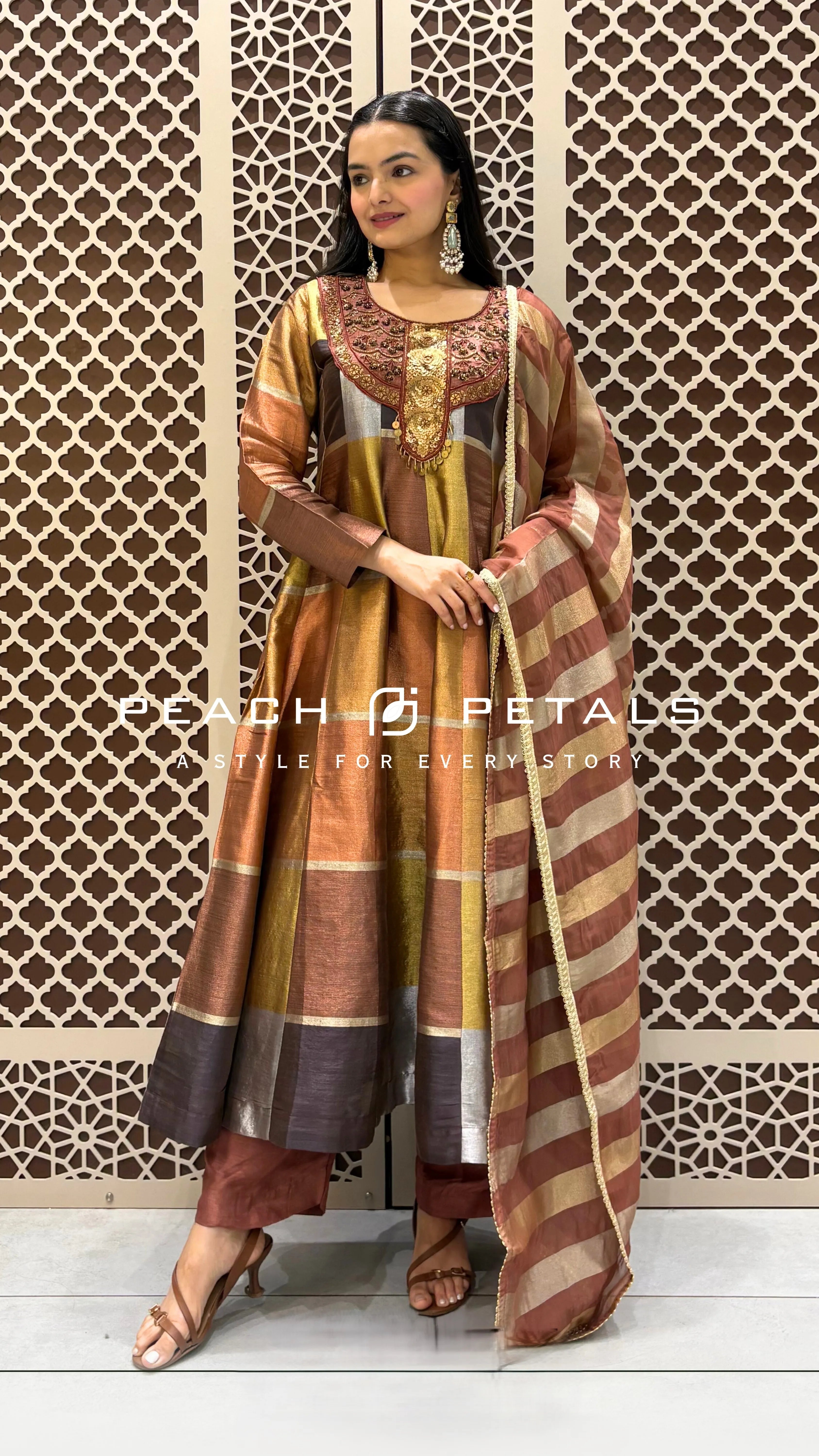Silk checkered Anarkali suit featuring heavy gold neck embroidery and a matching striped organza dupatta.