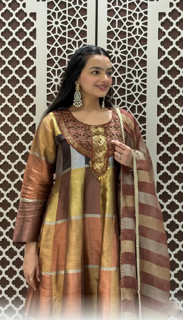 Silk checkered Anarkali suit featuring heavy neckline embroidery, metallic copper tones, and a striped matching dupatta.