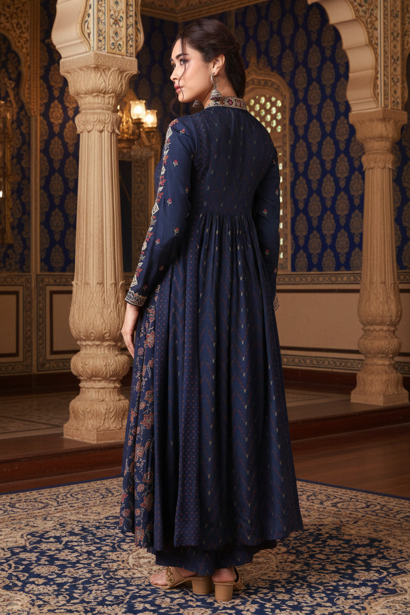 Woman wearing a navy blue dress with floral patterns on an orange background