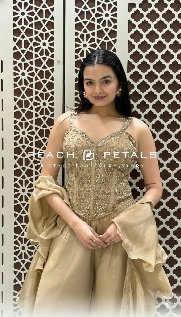 Metallic gold ethnic co-ord set featuring a heavily embroidered corset top and matching wide-leg trousers.