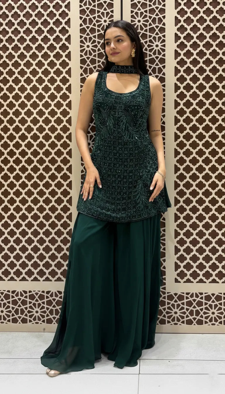 Bottle green sleeveless tunic featuring intricate sequin embroidery paired with matching floor-length flared sharara pants.