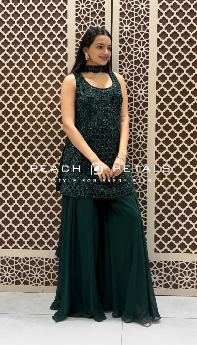 Bottle green sleeveless tunic featuring intricate sequin embroidery paired with matching flowy wide-leg sharara pants.