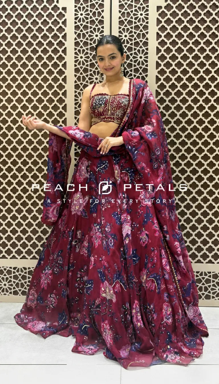 Maroon floral print lehenga set featuring a strappy embroidered crop top and matching lightweight dupatta.