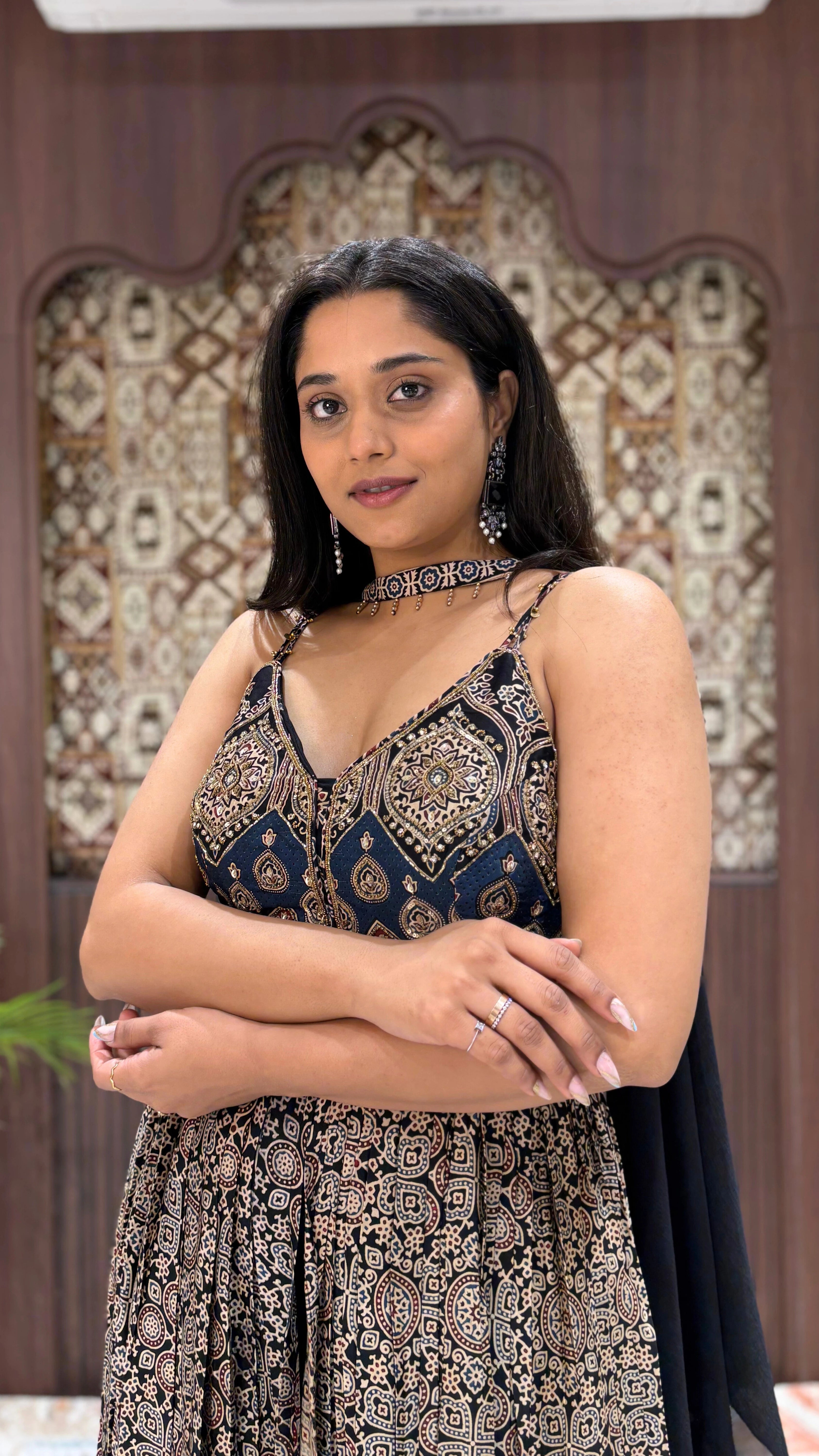 Elegant navy Ajrakh print Anarkali dress featuring spaghetti straps, intricate embroidery, and a matching fabric choker.