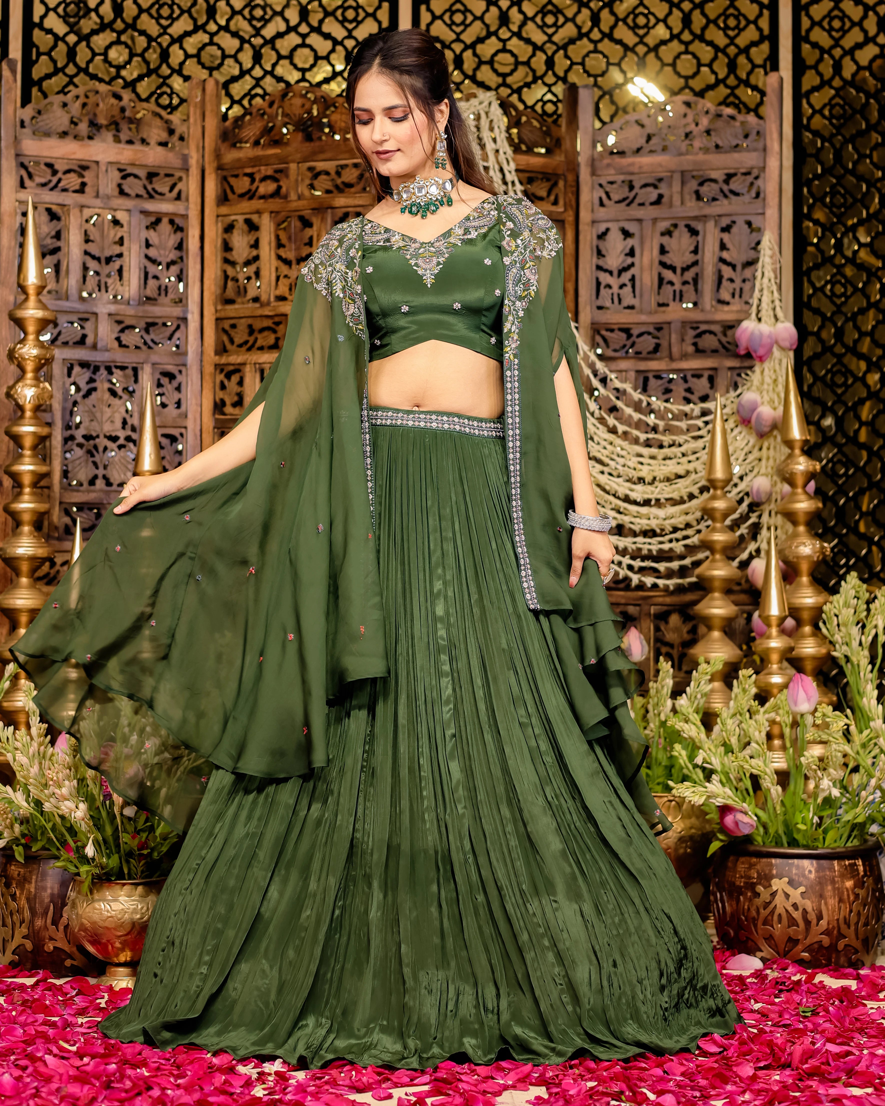 Elegant olive green lehenga with intricate Resham embroidery, featuring a sequined blouse and flowing cape.