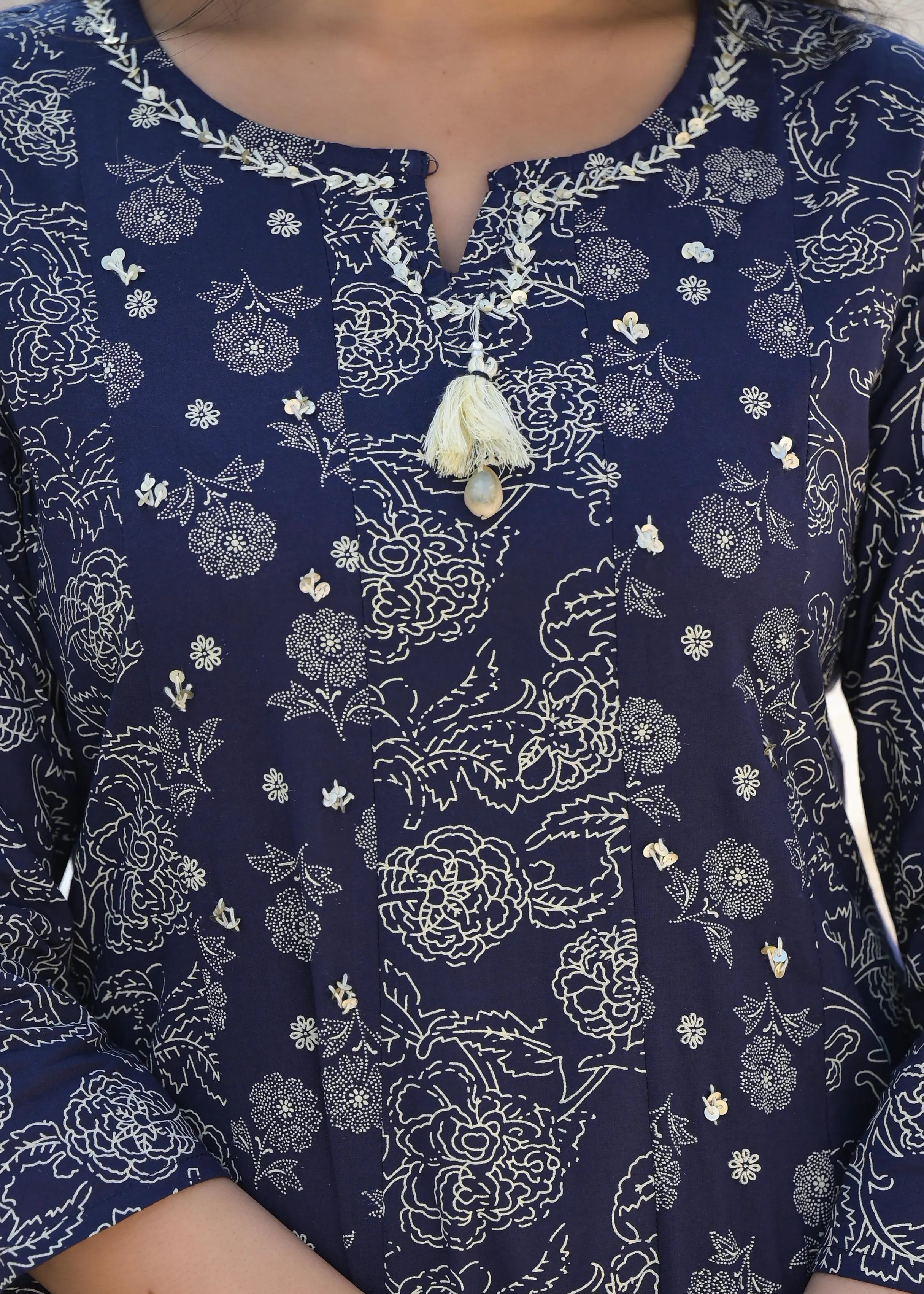 Navy blue garment with white floral pattern