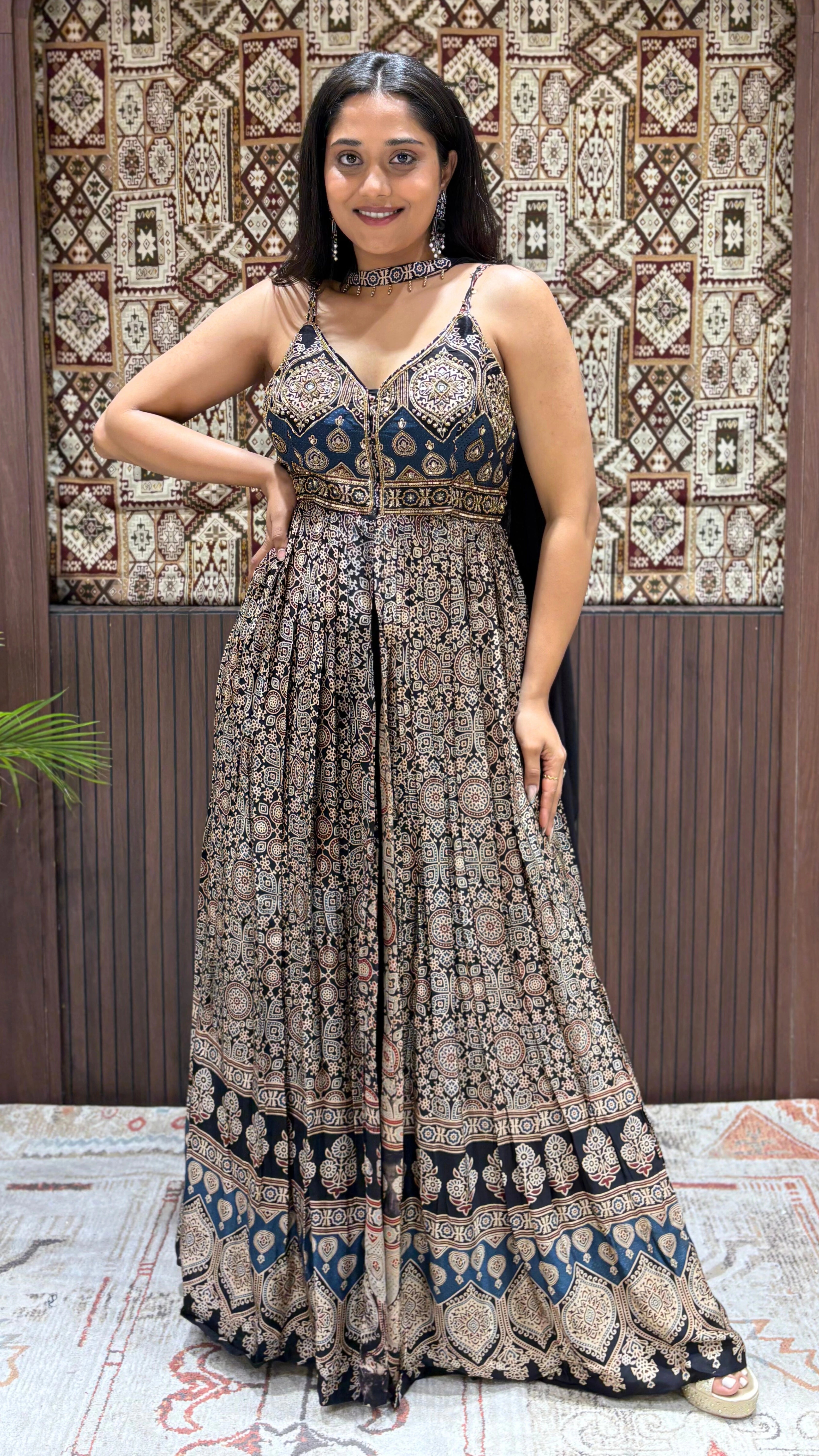 Navy blue Ajrakh print floor-length maxi dress featuring spaghetti straps, pleated skirt, and matching fabric choker.