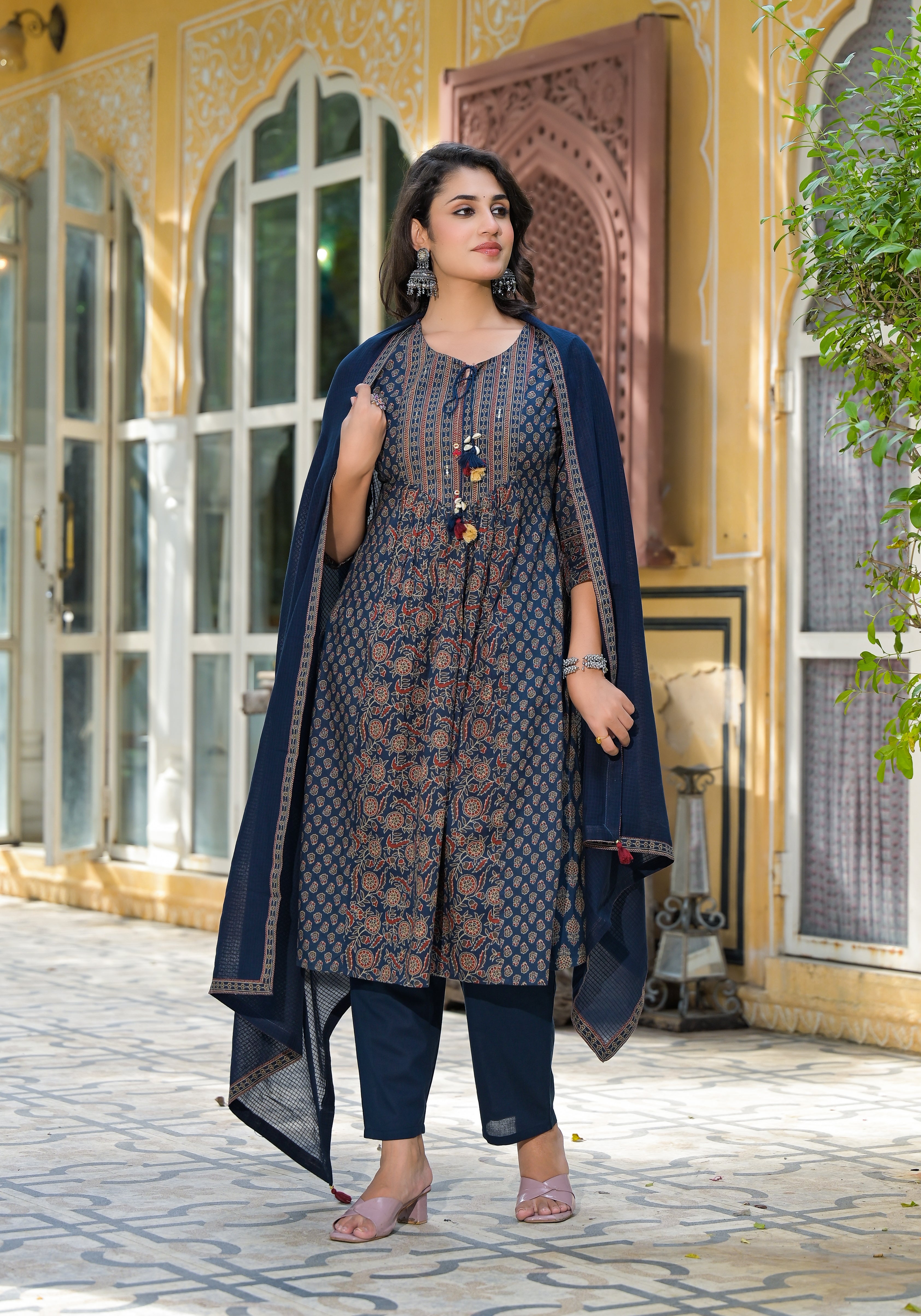 An Anarkali cotton kurta with a pant set is a beautiful and elegant ensemble that combines comfort with traditional charm.