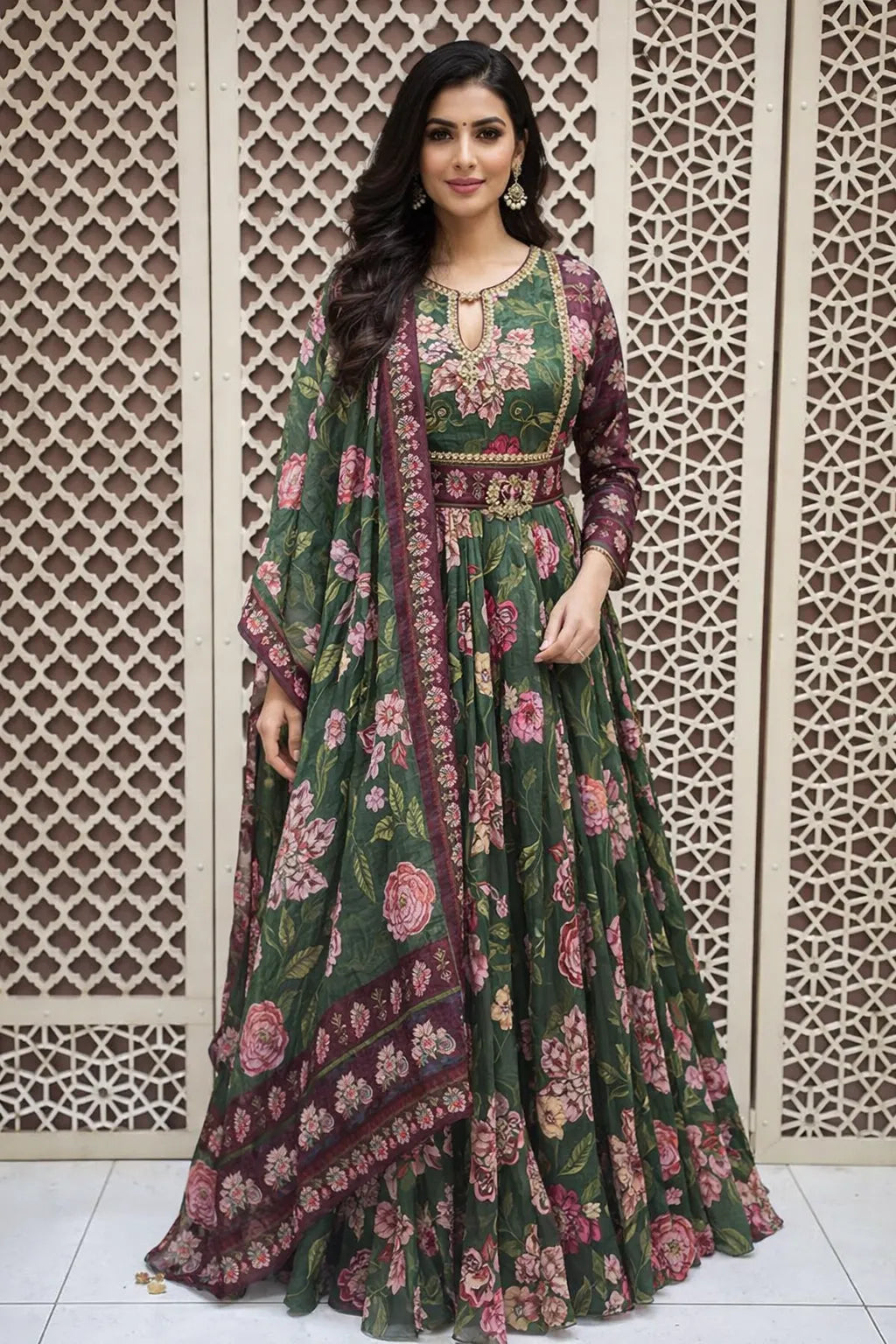 Dark green floor-length flared Anarkali featuring pink floral prints, long sleeves, and an embroidered sequin bodice.